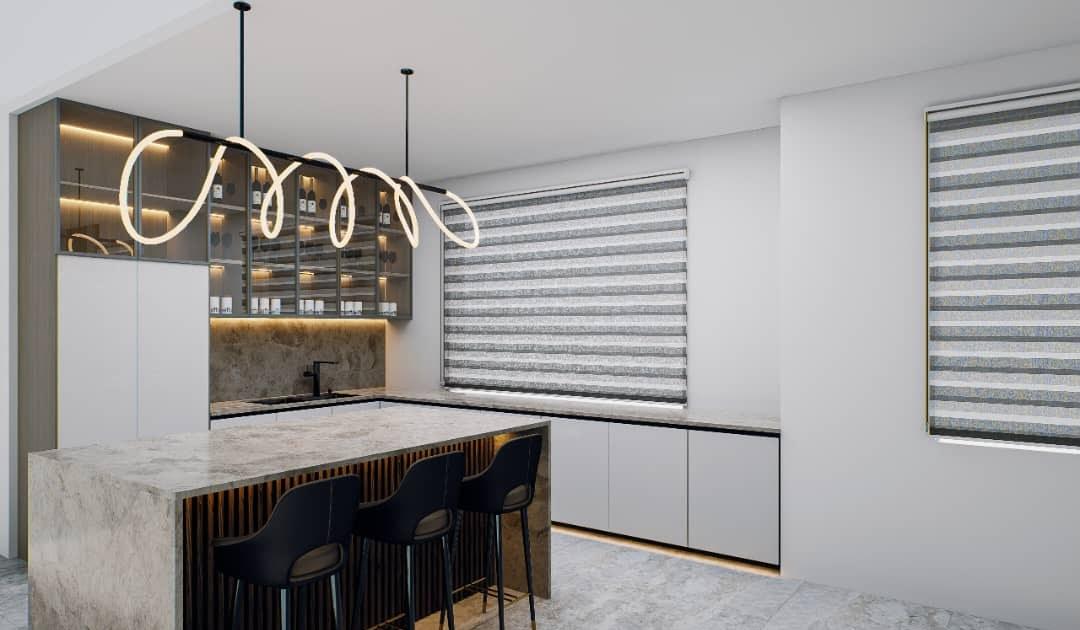 Dry kitchen design with a waterfall stone island, black bar stools, glass-fronted display cabinets and a looping LED pendant